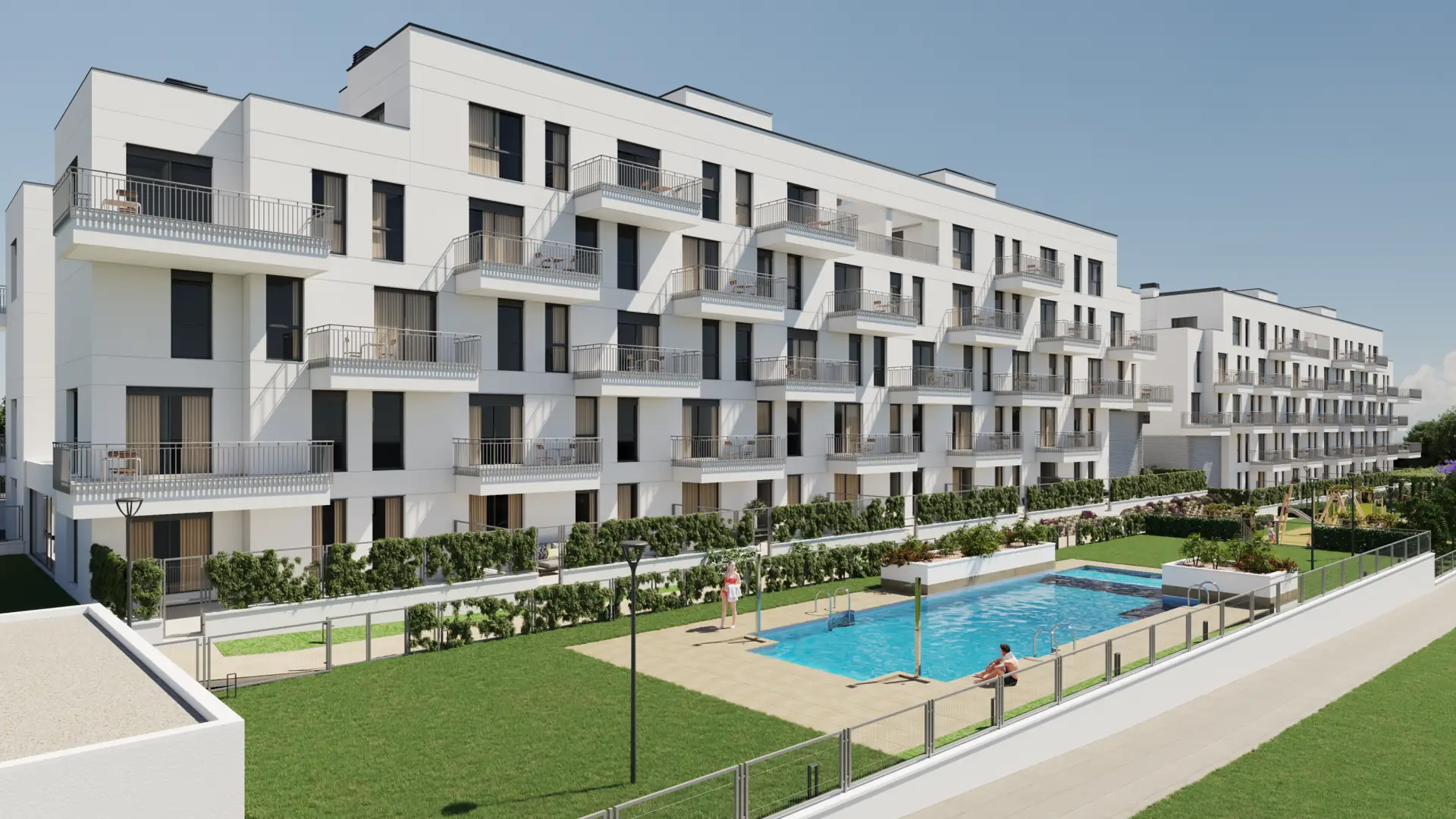 Fachada de edificio residencial de obra nueva con amplia zona ajardinada y piscina comunitaria